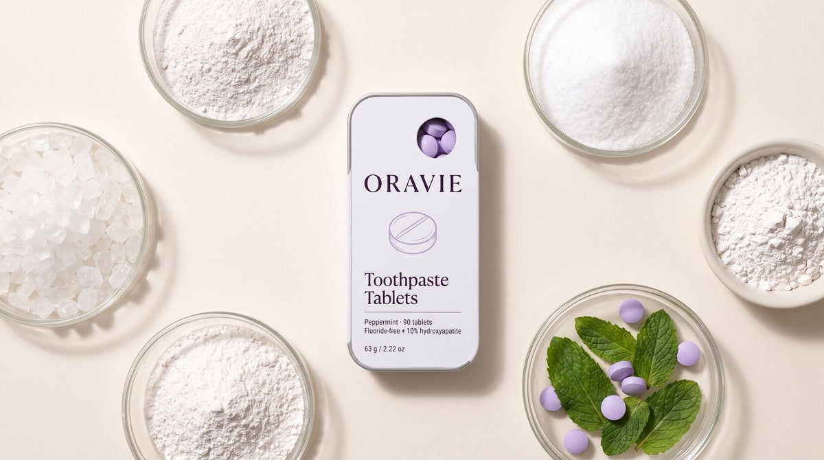 ORAVIE tin surrounded by dishes of white mineral powders, crystals and fresh mint leaves